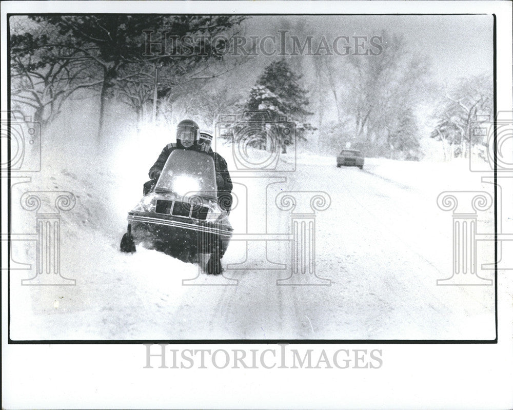 1978 Press Photo Joe Giarardi driving Tim Kelley in snowmobile. - Historic Images