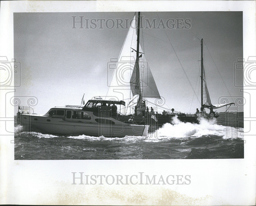 Press Photo Boat Flying Past Sailboats St Petersburg - Historic Images