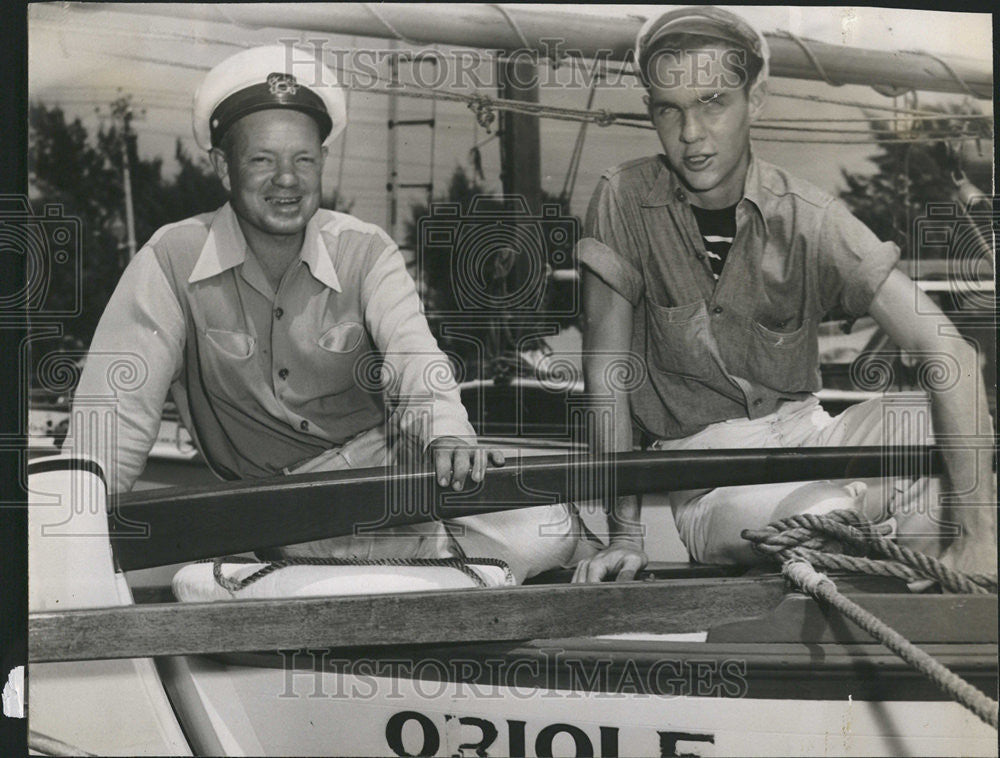 1950 Press Photo Leonard Burr Dion Powell sitting ship - Historic Images