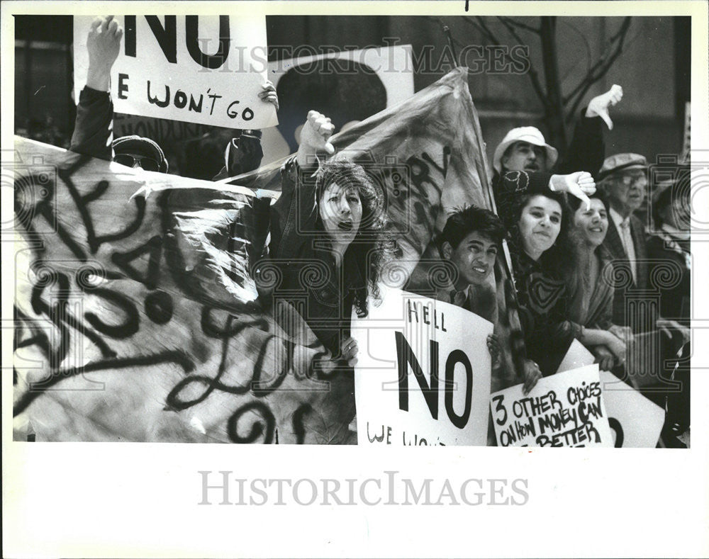 1987 Press Photo Parade Troops March La Salle Protesters Anti-Military Slogans - Historic Images