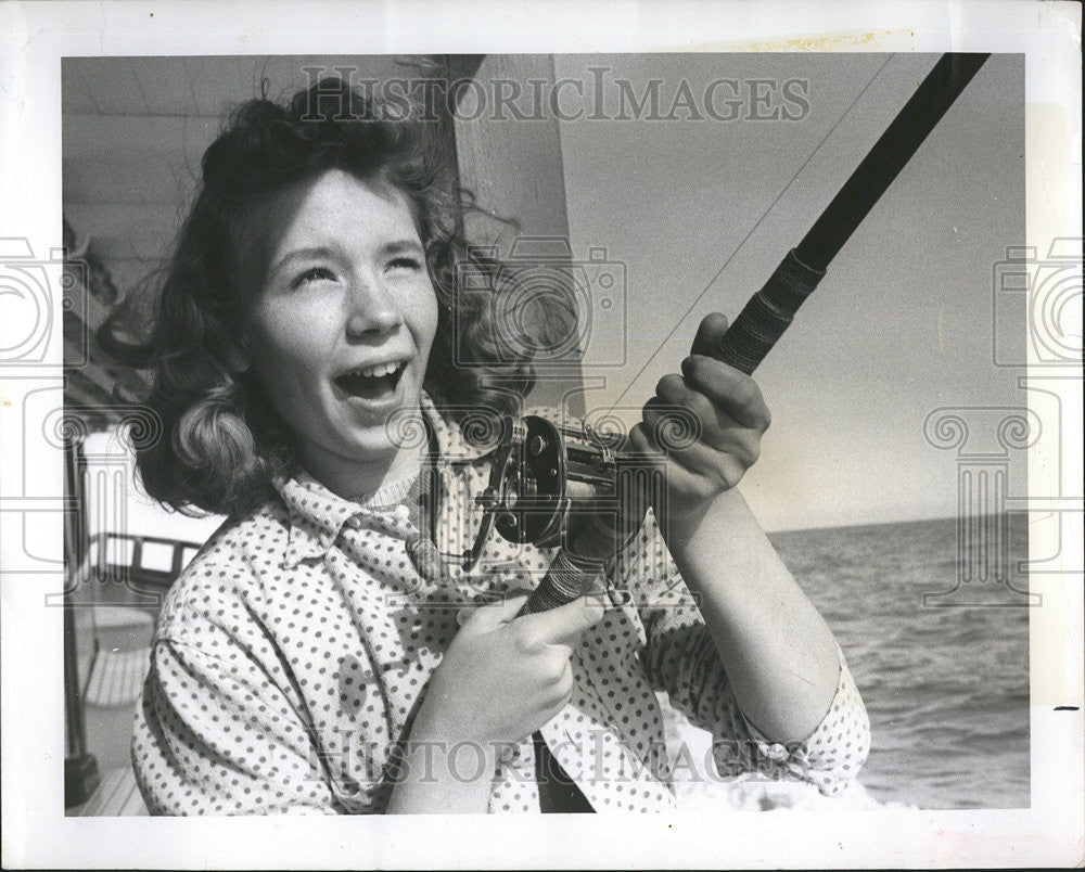 1959 Press Photo Picture of Miss Judy fishing from the boat. - Historic Images