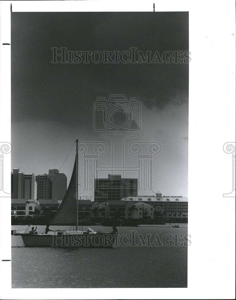 1988 Press Photo Sailboat Storm Clouds Clearwater Beach Florida - Historic Images