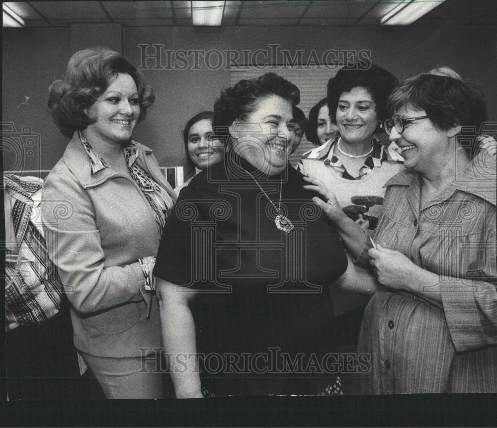 1975 Press Photo Helen Zuckerman Diamond being congratulated by co workers - Historic Images