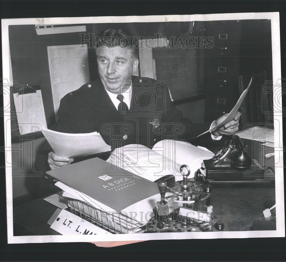 1957 Press Photo Leroy Marston Head Police Academy Busy Report Paper Plan Course - Historic Images