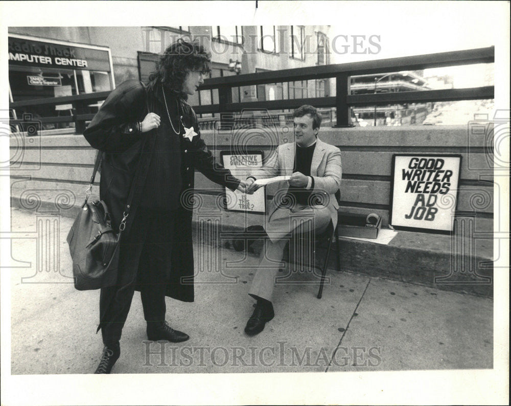 1987 Press Photo Franks Luby Gives a Resume to Carolyn Crimi for a job. - Historic Images