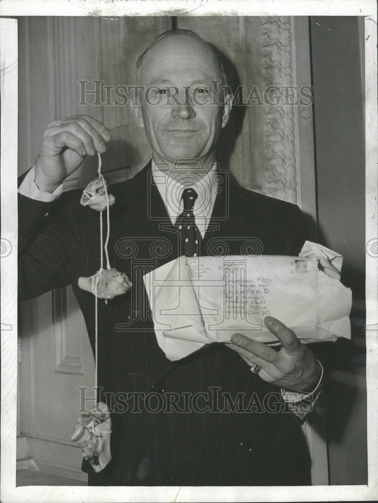 1943 Press Photo Fred Crawford, Michigan Representative, Displays Hawg Hooks - Historic Images