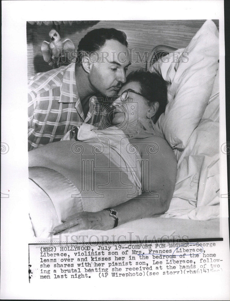 1957 Press Photo Violinist George Liberace Comforts Mother After She Was Beaten - Historic Images