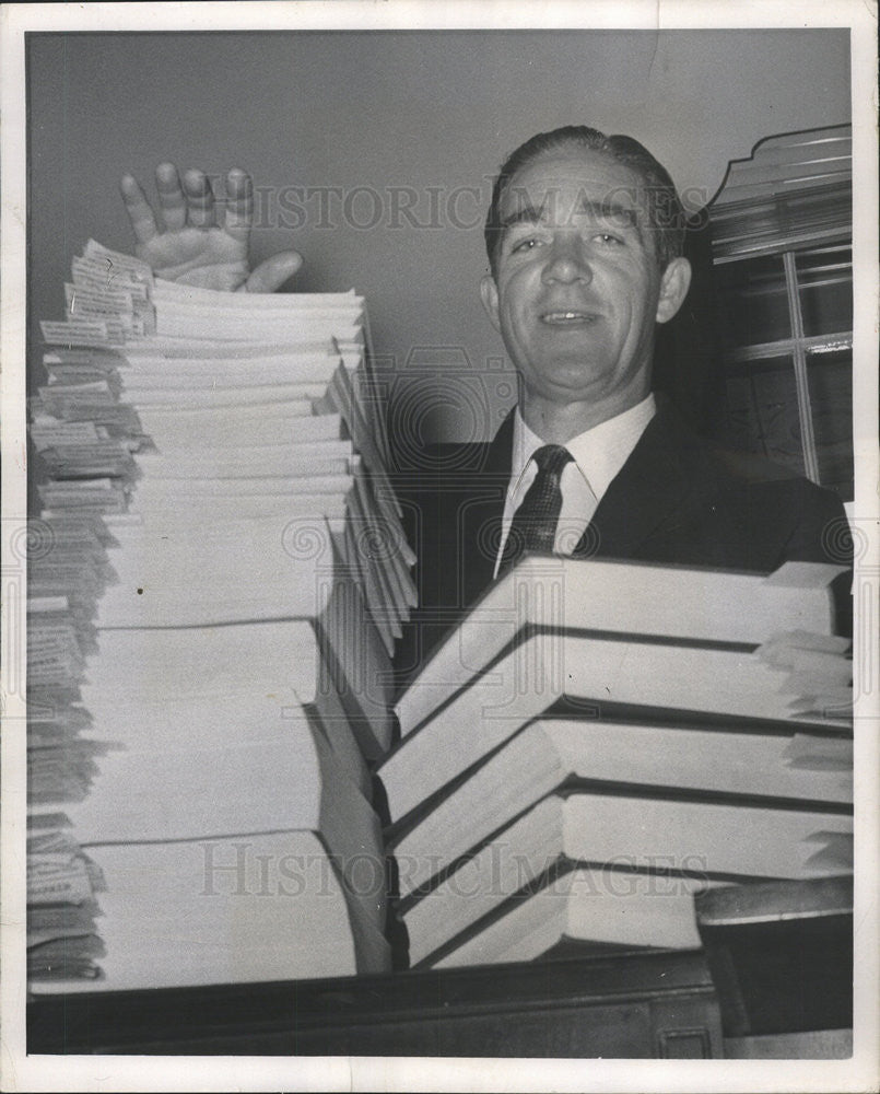 1958 Press Photo Timothy Sheehan Comparees records Washington Office Copies Pose - Historic Images