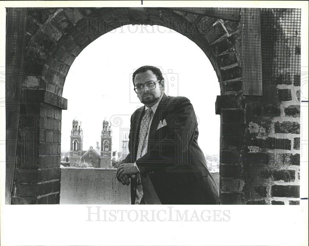 1986 Press Photo Bob Slayton Stands in the Steeple of Holy Cross Heart Church - Historic Images