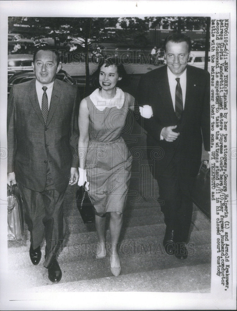 1955 Heiress Gloria Vanderbilt flanked by her 2 divorce attorney&#39;s - Historic Images