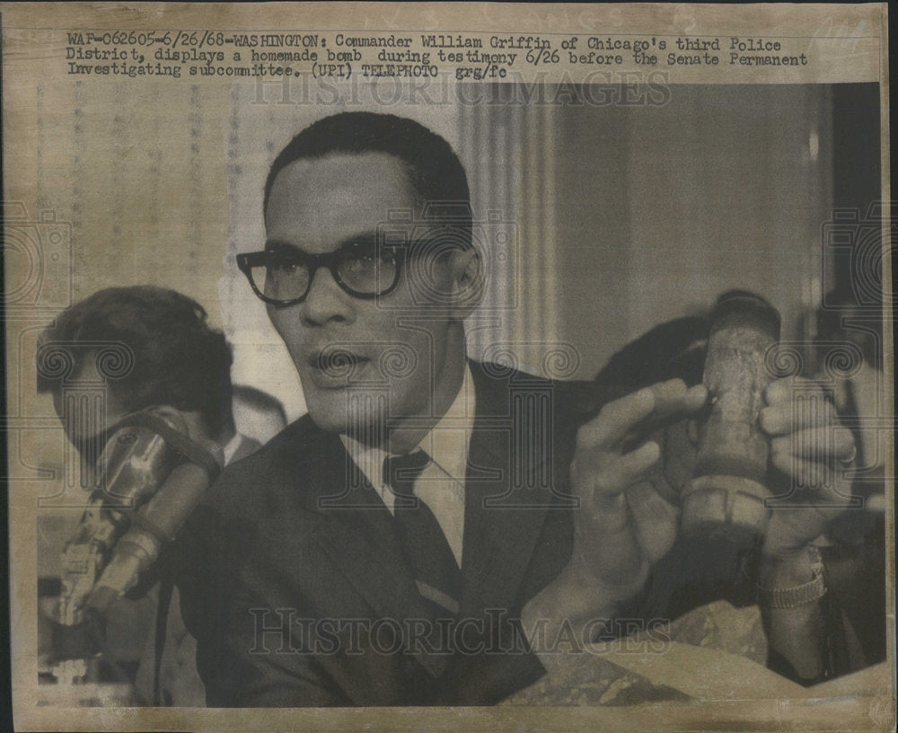 1968 Commander William Griffin of Chicago displays homemade bomb - Historic Images