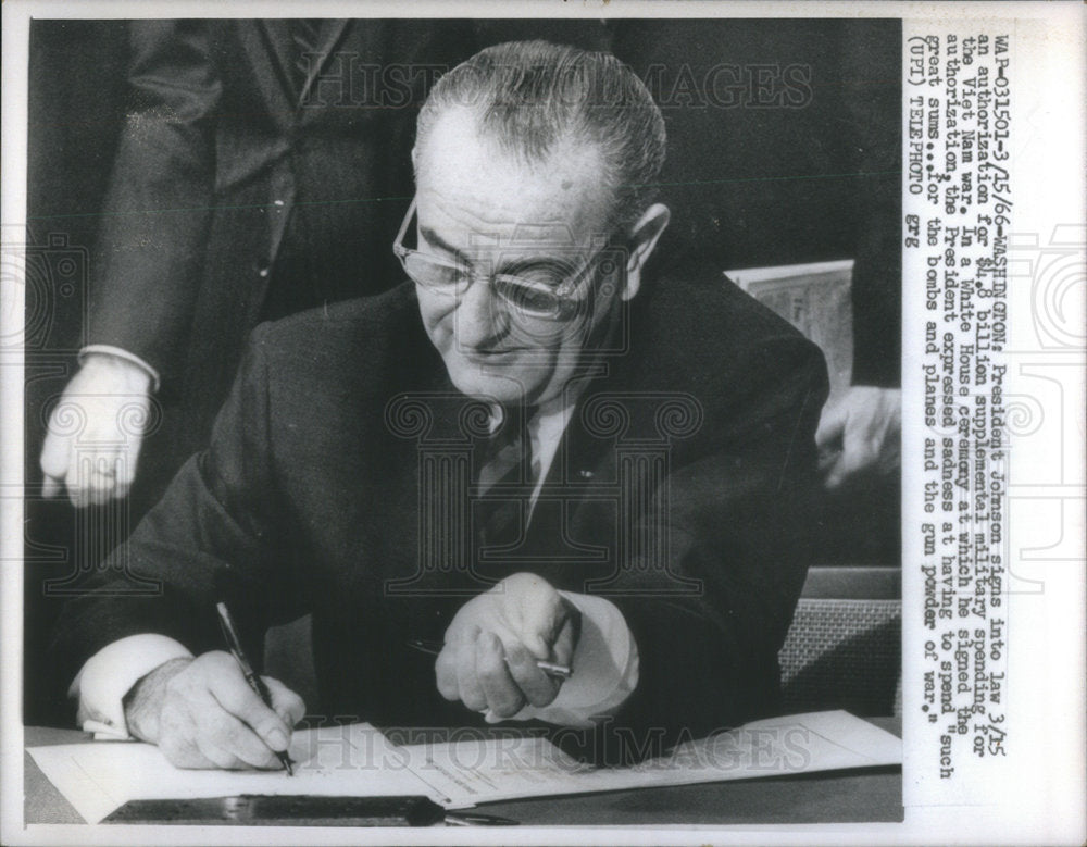 1966 President Johnson signing to law a supplemental military spendi-Historic Images