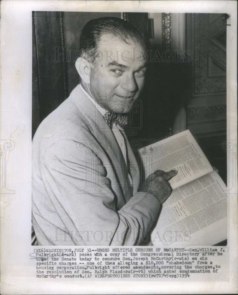 1964 Sen. William J Fulbright poses with a copy of the Congressional-Historic Images