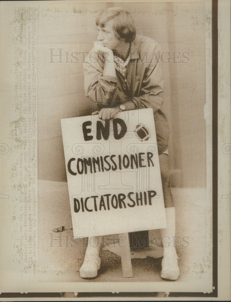 fan holds sign reads End Commissioner Dictatorship NFL - Historic Images