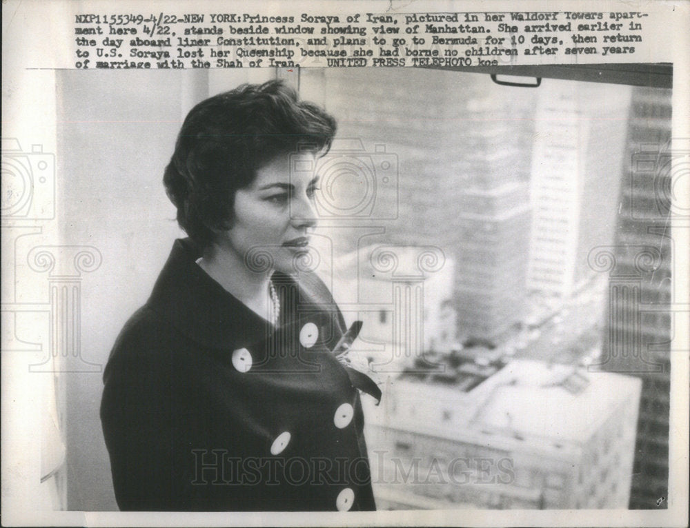 1958 Princess Soraya Iran stands beside window view Manhattan - Historic Images