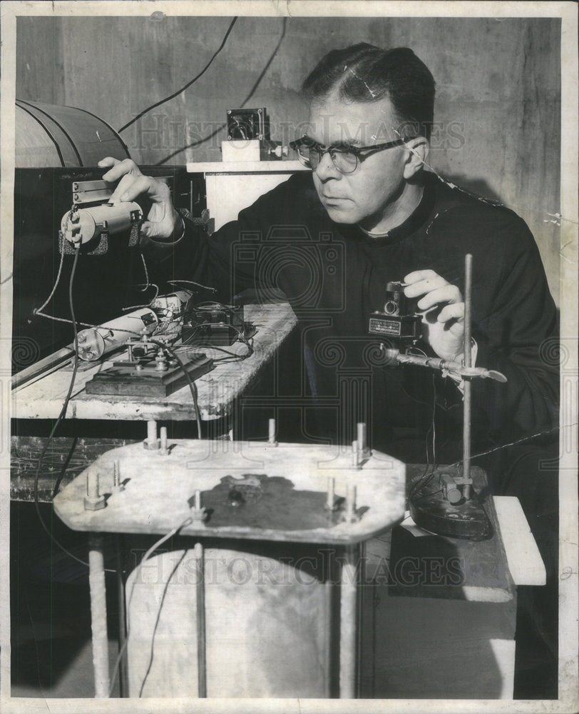 1957 Father J Donald Roll Head of Loyola Physics Dep't Aligns Light - Historic Images