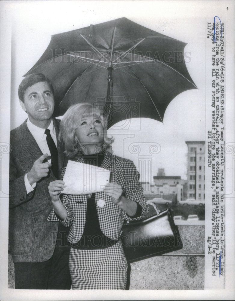 1965 singer Tommy Leonetti protects bride actress Cindy Robbins - Historic Images