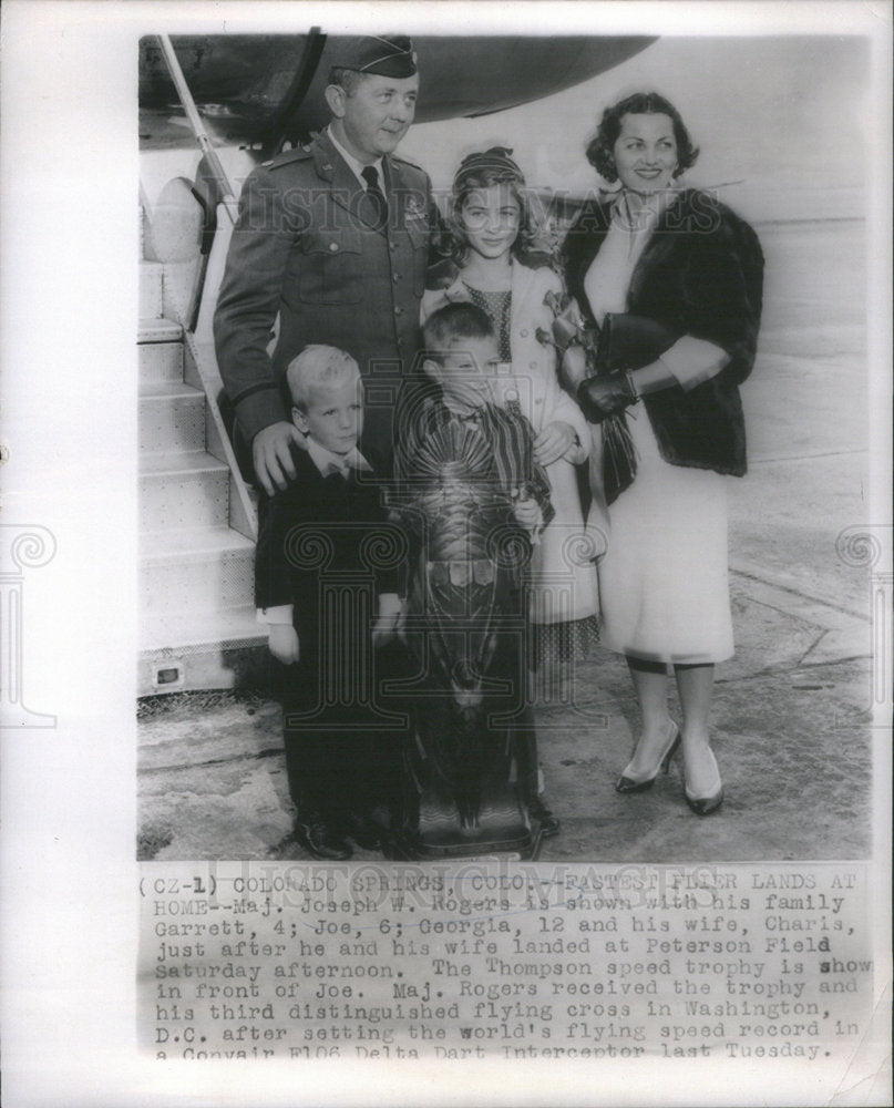 1959 Maj. Joseph Rogers with his wife and children after landing in - Historic Images