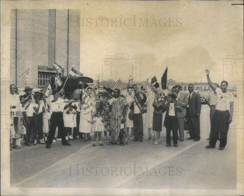 1958 Welcoming party waves Ghanaian and US flags.-Historic Images