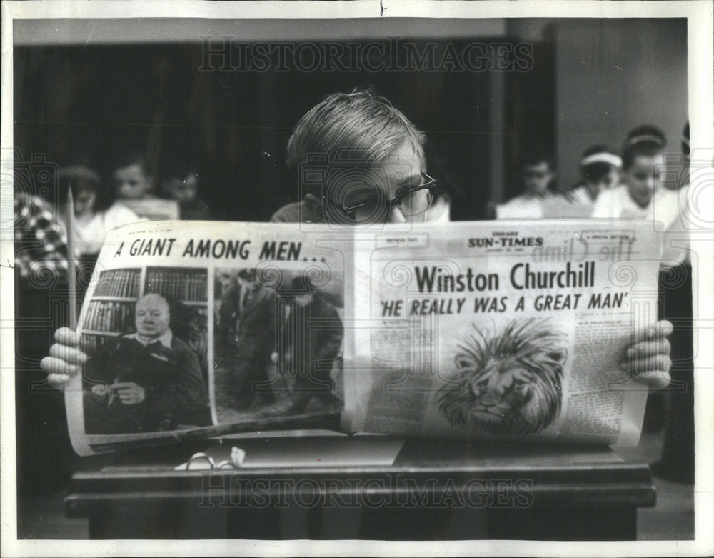 1965 Roy Hozey of Grover Cleveland School reading paper - Historic Images