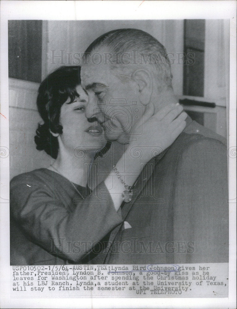 1964 Lynda Bird Johnson gives her father president Lyndon Johnson - Historic Images