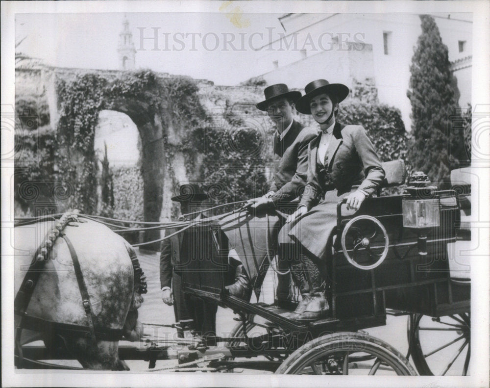 1953 Marquis and Marchioness of Villaverde ridding a carriage - Historic Images