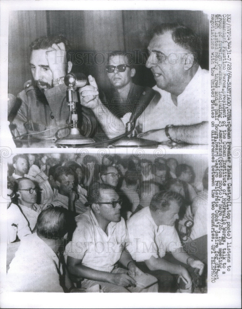 1964 Press Photo Cuban Fidel Castro Listens To Faustino Perez Talk To Newsmen - Historic Images