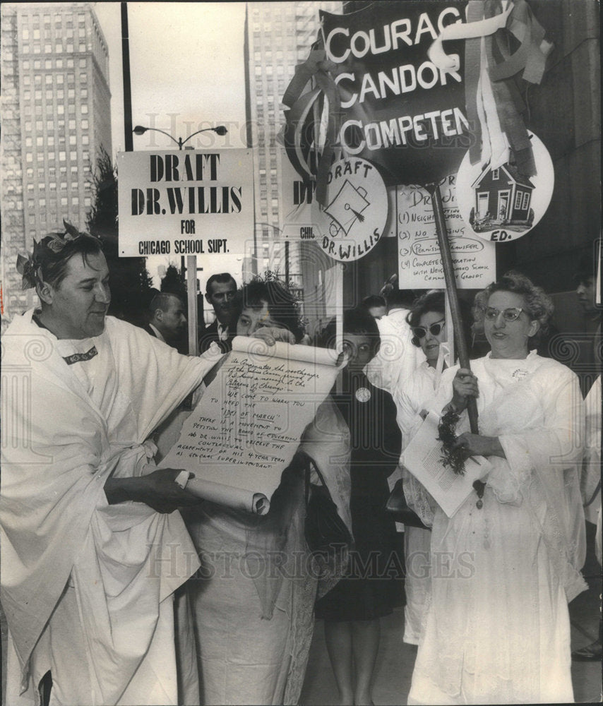 1966  Steve telow reading a scroll wearing Roman Togas. - Historic Images