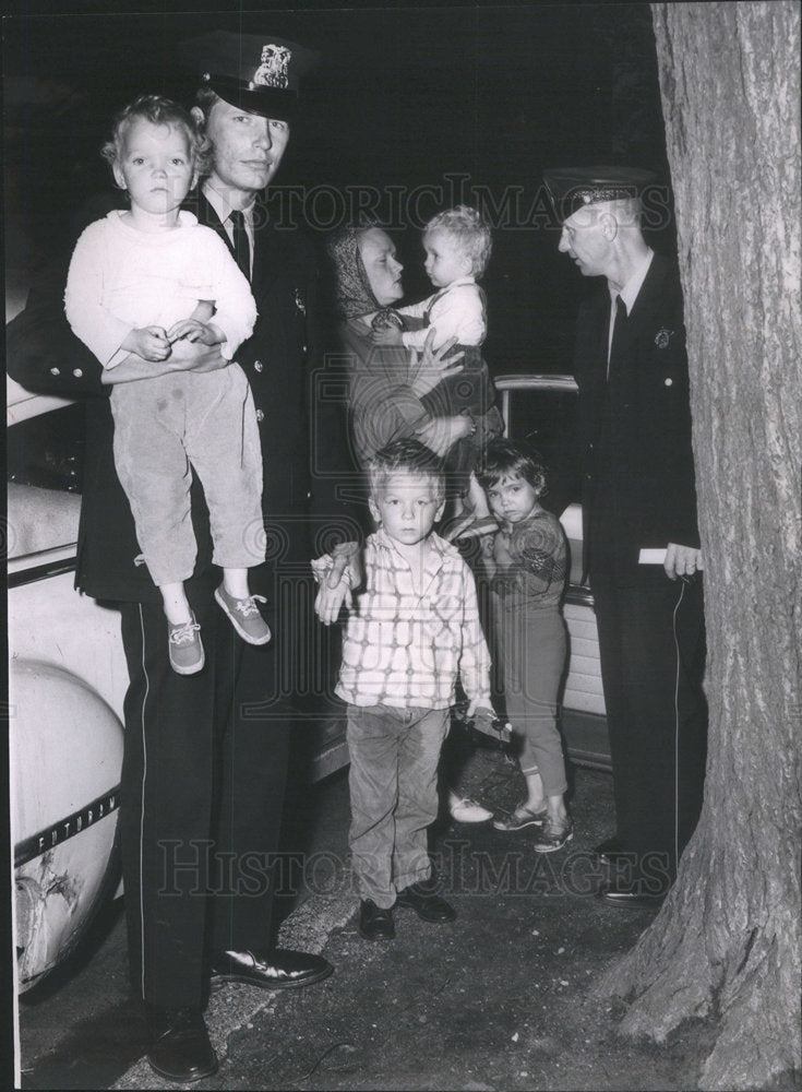 1963 Policeman Robert Mika at the Salvation Army Headquarters. - Historic Images