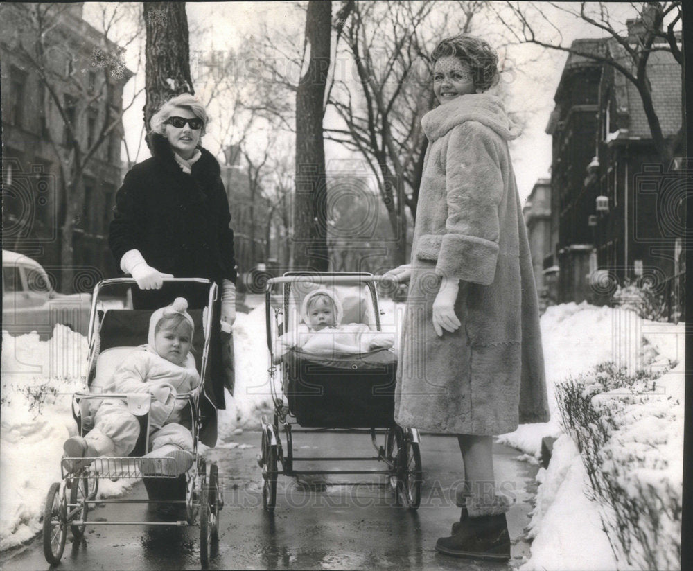 1960 Mrs. Chrsi Paschen on winter coats and snug boots - Historic Images