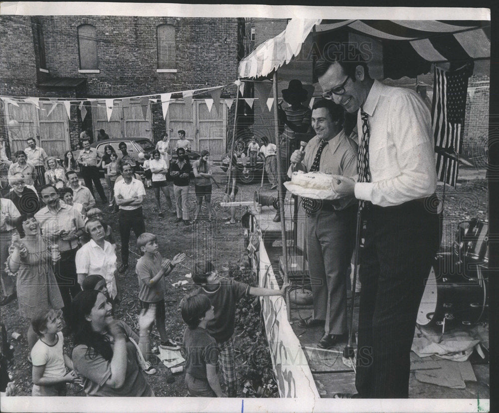 1971 John Rockefeller IV Accepts Birthday Cake from Alderman Singer - Historic Images