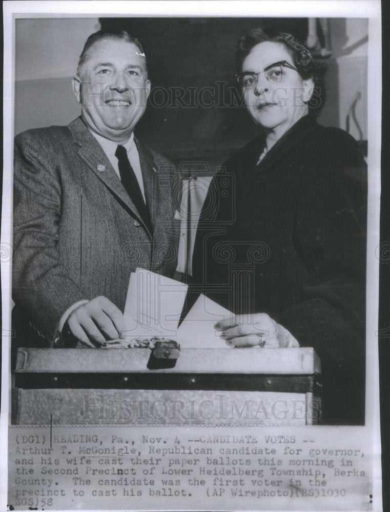 1958 Press Photo Arthur T McGonigle and wife cast paper ballots. - Historic Images