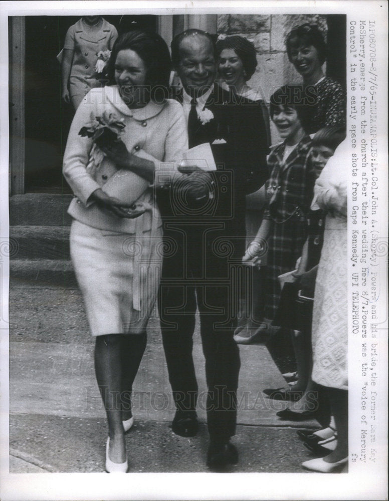 1965 Lt. Col Powers and his bride emerge from the church. - Historic Images