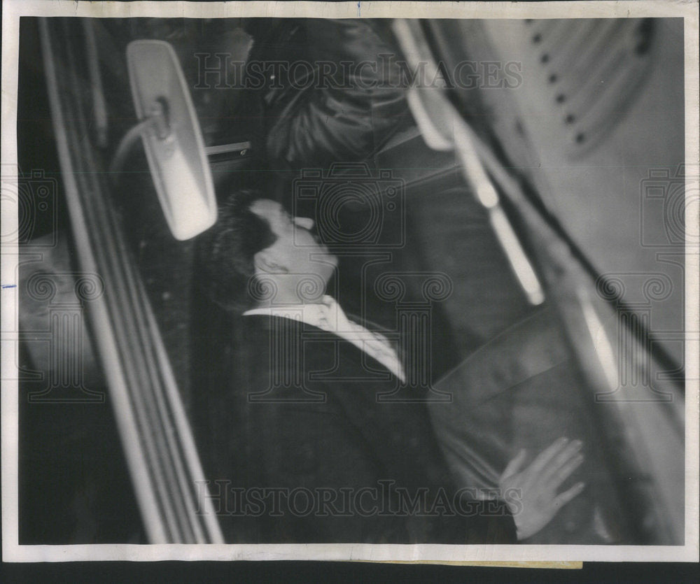 1963 Press Photo Donald Rowlen an official of the Playboy club gets into a squad - Historic Images