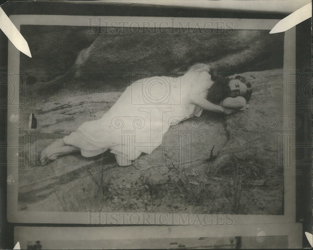 Irving smith laying on ground - Historic Images