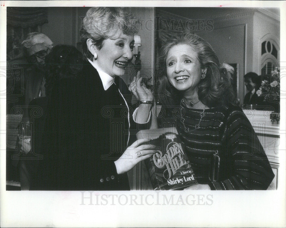 1982 Press Photo Author Lord Toasting New Novel With Miglin - Historic Images