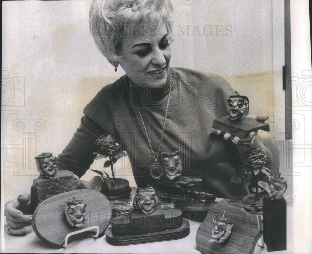 1963 Bunny Miller carves roses out of apples  - Historic Images