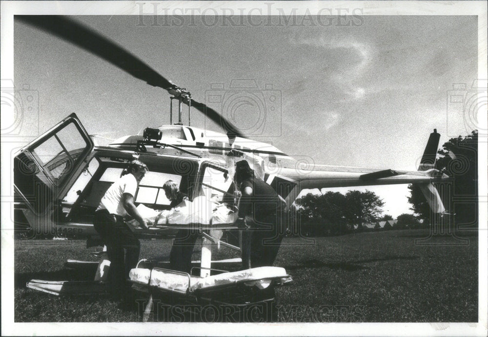 1979 Press Photo Patient Being Loaded Onto Helicopter Holy Cross Hospital - Historic Images
