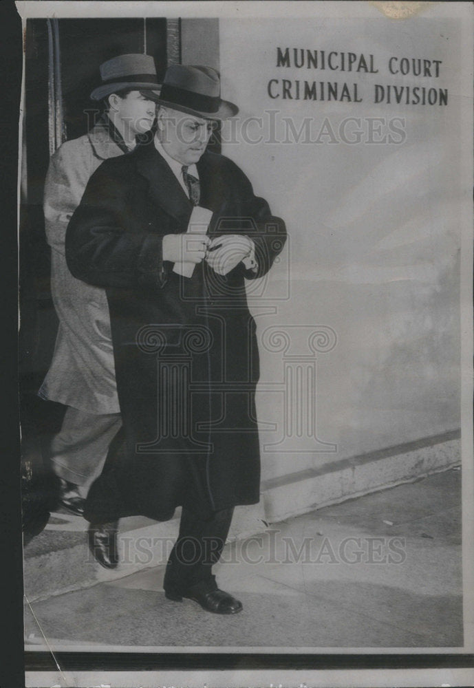 1947 Former Congressman Andrew J. May Leaves Municipal Court - Historic Images