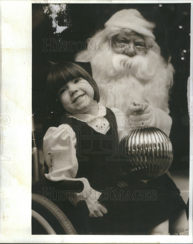 1991 Press Photo Brigid Mason 1991 Easter Seals poster child meets Santa - Historic Images