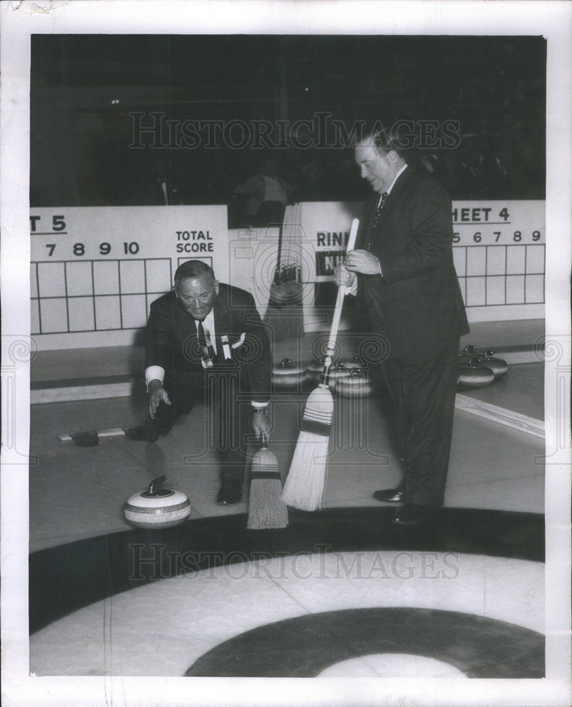 1957 Press Photo Hughston McBain sends the first stone spinning down the center - Historic Images