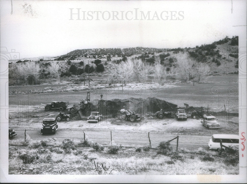 1956 Trucks and loaders hauling topsoil to undeveloped park. - Historic Images