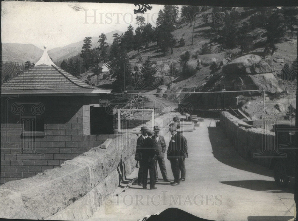 1927 People talking on a road. - Historic Images