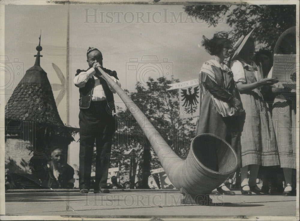 1934, Dairyman Plays Alphorn Switzerland - RSC87125 - Historic Images