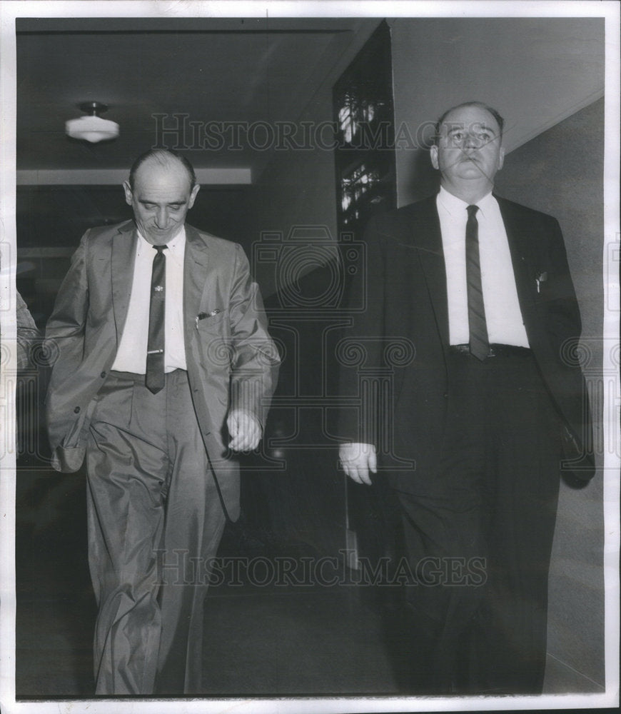 1962 Maury Marsh is walking with Ruddy chief investigator. - Historic Images