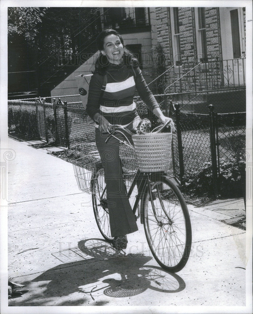 1972PressPhoto Susan Peterson Pedaling to Television Studio in Jeans and T-Shirt - Historic Images