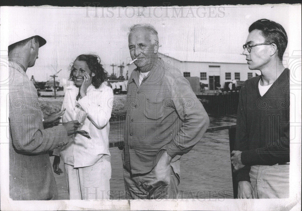 1957 Press Photo Retired Investment Banker, Wife &amp; Crew Sinking Yacht Rescue - Historic Images