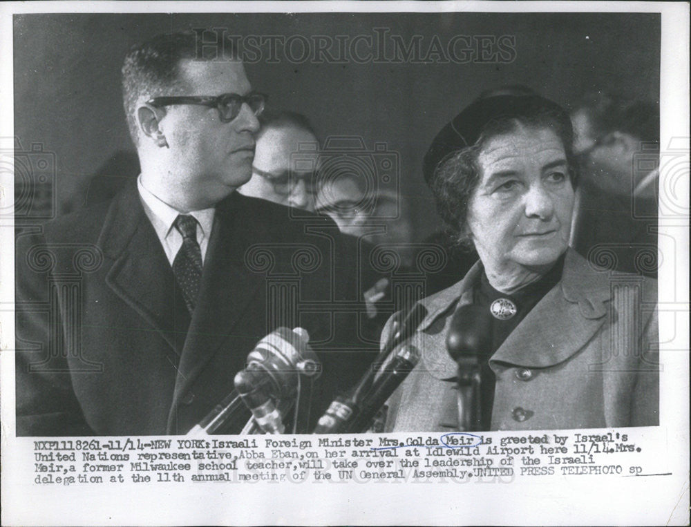 1956 Press Photo Mrs. Golda Meir greeted by UN Representative Abba Eban. - Historic Images