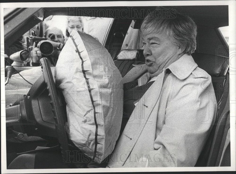 Press PhotoGov. Dixy Lee Ray tests an airbag - Historic Images