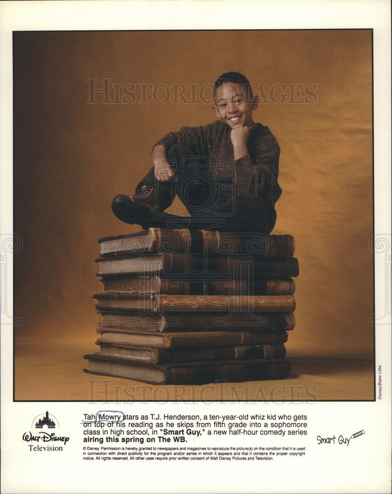 Press Photo Smart Guy Series Actor Mowry Sitting On Large Books Promotional - Historic Images